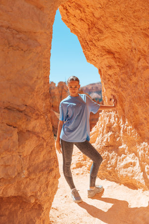 Hiker girl in Bryce Canyon hiking relaxing looking at amazing view during hike on summer travel in Bryce Canyon National Park, Utah, United States.の写真素材