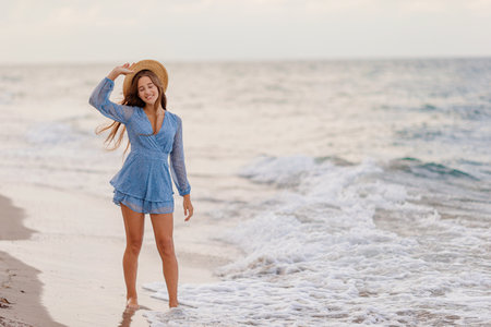 Happy girl enjoy summer vacation on the beachの写真素材