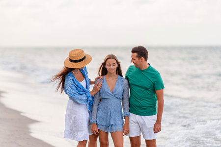 Happy family on the beach during summer vacationの写真素材