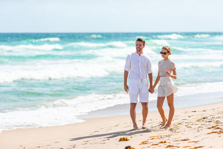 Adorable girl and happy dad having fun during beach vacationの写真素材