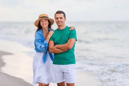 Young couple on white beach during summer vacation.の写真素材