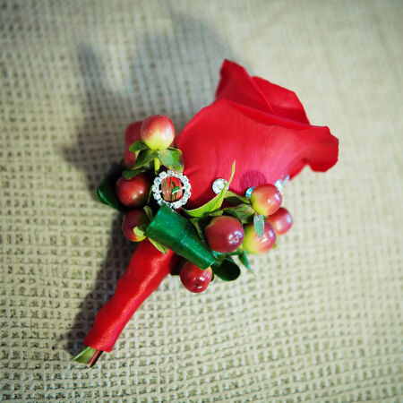red buttonhole flower