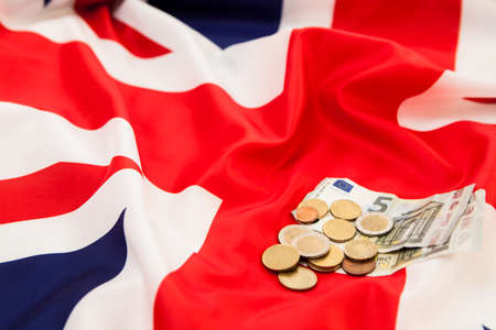 A small fee on the background of the flag of the United Kingdomの写真素材