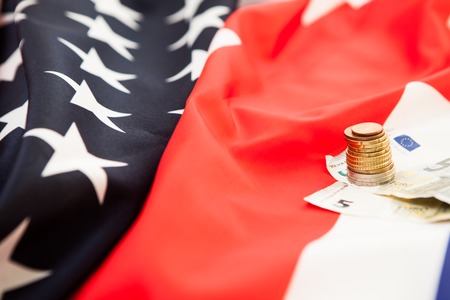 Lowering the cost of public transport on the background of the flag of the United Statesの写真素材