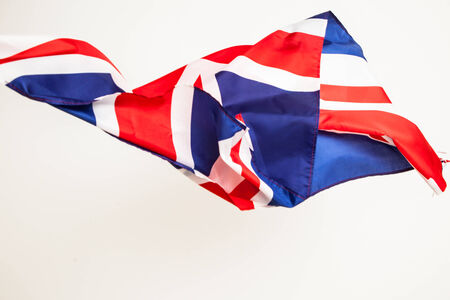 The fall of the flag of Britain. Falling leaf of a great state.の写真素材