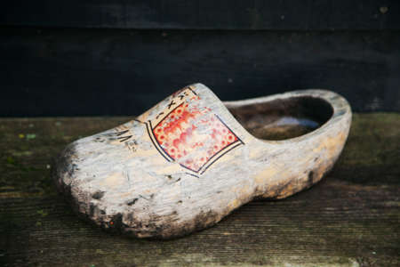 top view of a souvenir wooden sneaker vintage shabby with a color patternの写真素材