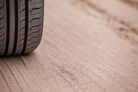 Off road 4X4 wheel tracks on country desert beach road sand motoring background imageの写真素材