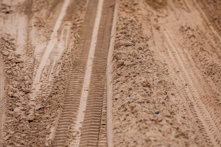 Off road 4X4 wheel tracks on country desert beach road sand motoring background imageの写真素材