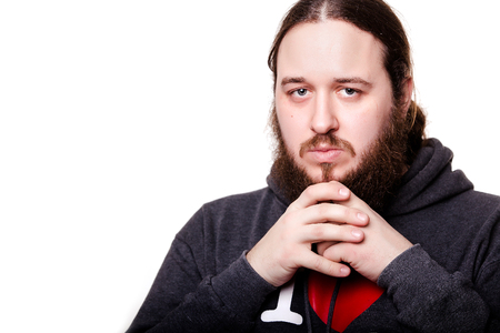 Portrait of serious designer in reflections, on white background