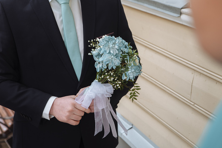 Young handsome groom waiting for his future wifeの写真素材