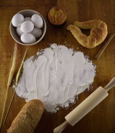 Bake ingredients on a wood backgroundの写真素材