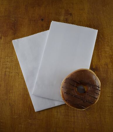 white paper bag with a donutの写真素材