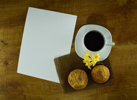 white sheet with coffee and muffinsの写真素材