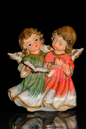 Angels with notes on black backgroundの写真素材