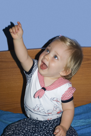 Portrait of a baby girl looking upの写真素材