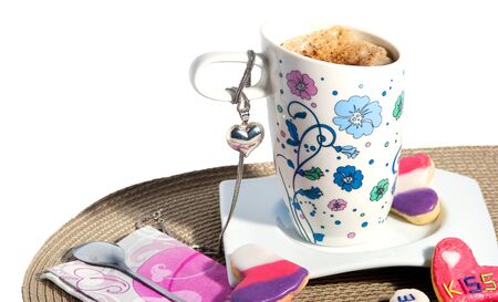 Delicious homemade cookies and a  cup of coffee on whiteの写真素材