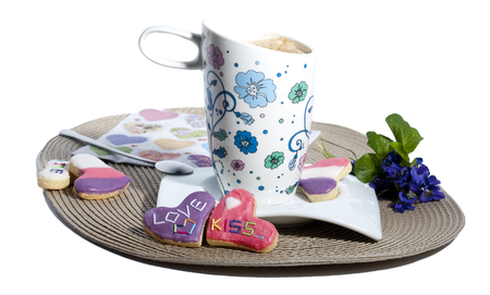 Delicious homemade cookies and a  cup of coffee on whiteの写真素材
