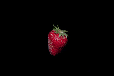 Fresh strawberry isolated on black backgroundの写真素材