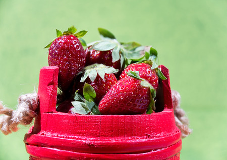 Red basket full of strawberriesの写真素材