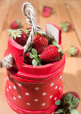 Red basket full of strawberriesの写真素材
