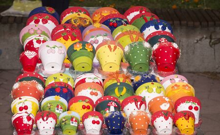 PIle of ceramics pots different colorsの写真素材