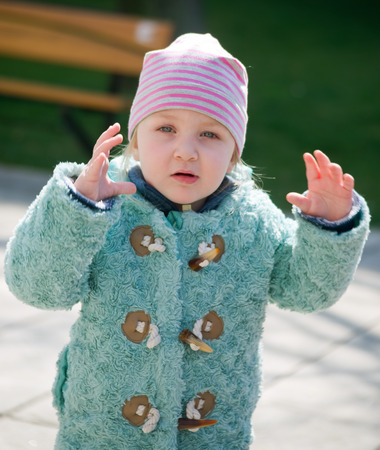 Little girl is playing outsideの写真素材