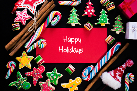 Winter frame: christmas decoration surrounding red envelope on black backgroundの写真素材