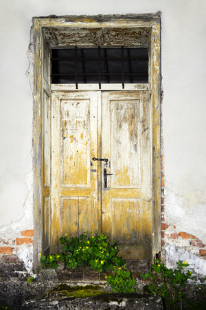 Ruined house's old doorの写真素材