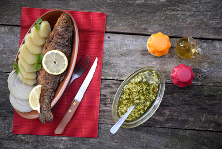Baked trout fish with potatoesの写真素材