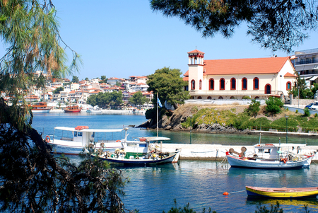 View of the boats and a seaside town churchの写真素材