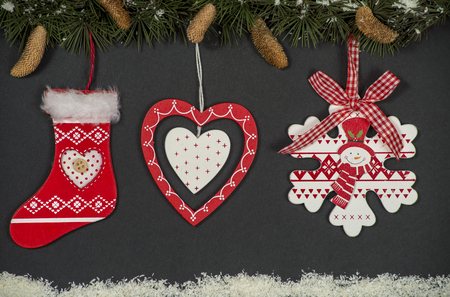 Christmas decorations hanging of a evergreen treeの写真素材