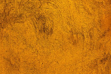 Yellow colored background with textures of different shades of yellow and orangeの写真素材