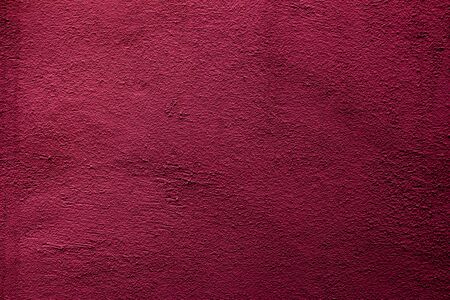 Crimson colored background with textures of different shades of crimsonの写真素材