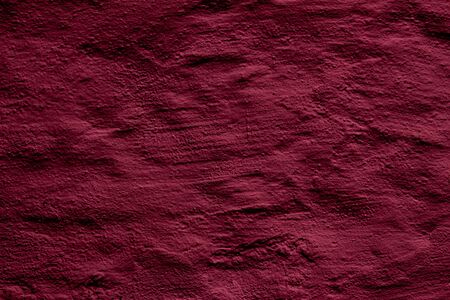 Crimson colored abstract wall background with textures of different shades of crimson and redの写真素材