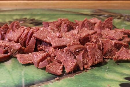 Turkish raw sausage sucuk cut to small pieces as ingredient for soup