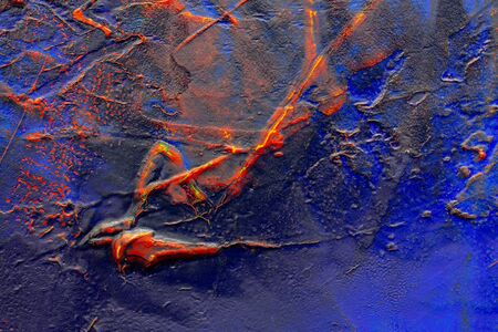 Close up detail of a acrylic painting with textures of dark blue, red and yellow