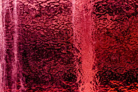 Crimson colored abstract background with textures of different shades of crimson and redの写真素材