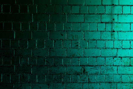 Petrol brick wall background with shades of light and dark tealの写真素材
