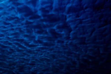 Abstract blue colored background with textures of different shades of blueの写真素材