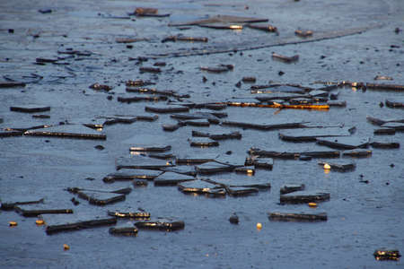 Ice floe lying on a frozen lake for winter background