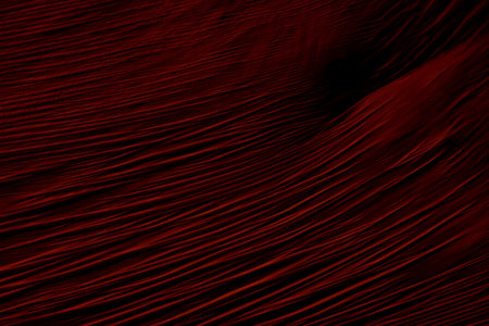 Crimson red abstract plastic foil background with 3d effect and bubblesの写真素材