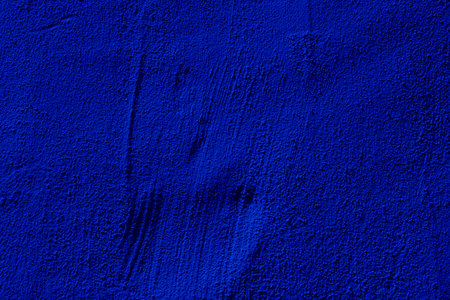 Blue colored abstract wall background with textures of different shades of blueの写真素材