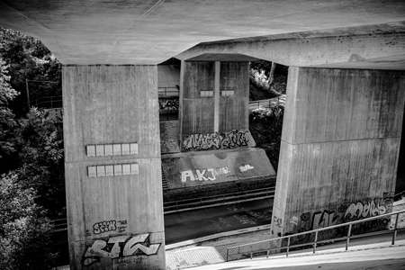 architecture and art under the railway bridge in black and white create a surreal picture