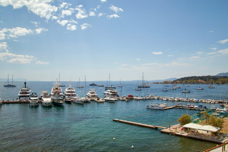 the beautiful yacht club Kerkyra harbor with boats, yachts and sailing shipsの写真素材