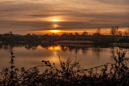 Sun setting over Harthill reservoir, Sheffield, U.K.の写真素材