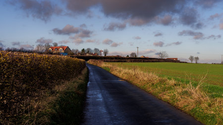 Country road leading to the rural village of Harthill , Nr Sheffield, on a sunny winters day.の写真素材