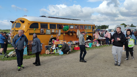 Worksop, Nottinghamshire, United Kingdom-June 12 2022: Oldcotes car boot and Sunday market. People walking round looking at stalls.の写真素材
