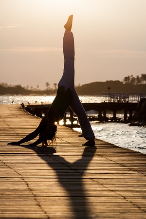 Yoga practise during sunsetの写真素材