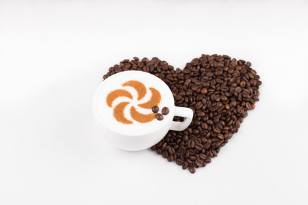 Real capuccino decorated with cinnamon an coffee beansの写真素材
