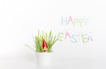 Easter decoration made of grass and egg-shell face with hairの写真素材